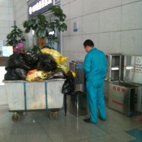Qingdao Airport Maintenance Worker: good job! Way to NOT recycle!